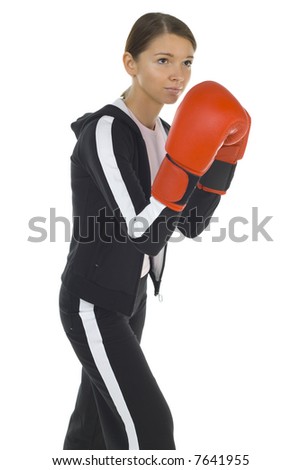 Young beauty with boxing gloves. Holding hilt-guard and looking at something. White background, side view