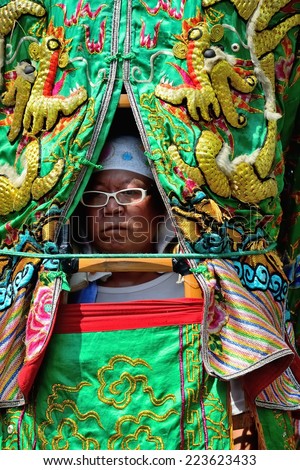 Tainan, Taiwan - Mar. 15th :The Matsu pilgrimage period, huge puppets of the gods of the believers must endure March hot weather on Mar. 15th ,2013 in Tainan, Taiwan