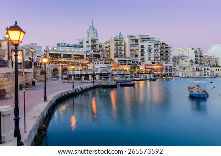 MALTA, SAINT JULIAN\'S - March 29 2015: Sunset on Saint Julian\'s. Saint Julian\'s is Malta\'s top tourist destination full of restaurants, entertainment and nightlife