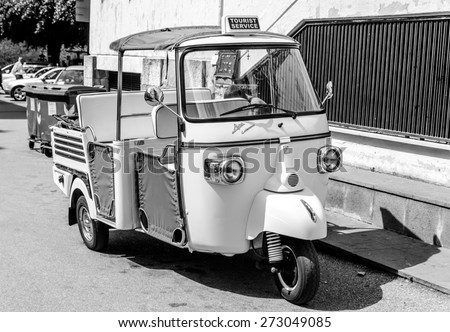 TAORMINA, ITALY - APRIL 25, 2015: Three-wheeled light commercial vehicle Piaggio Ape in the streets of Taormina in Sicily