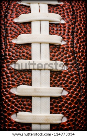 Closeup of laces on American football.