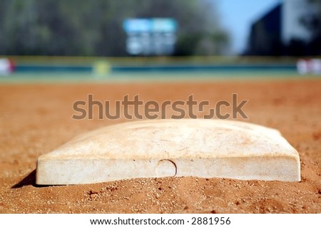 Baseball Field.  Second Base with Scoreboard in Background.