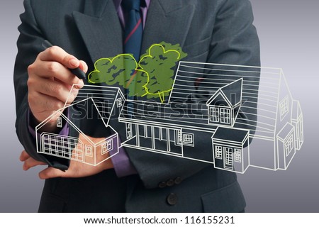Architect drawing house on screen