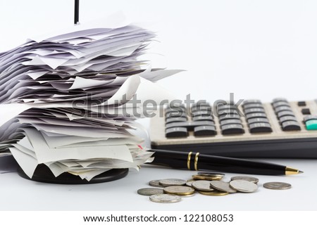 Bills in paper nail on business desk