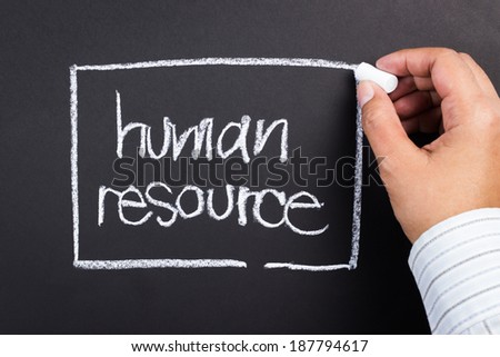 Hand writing Human Resource word with chalk