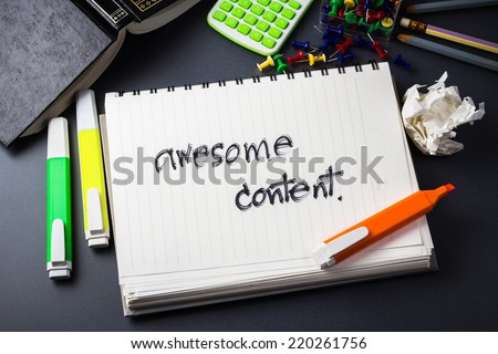 Handwriting of Awesome Content word in notebook for website content concept
