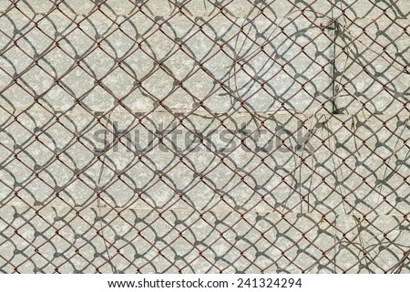 Closeup Rusty mesh wire on gypsum board of old fence