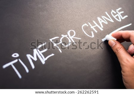 Time for Change, closeup hand writing on blackboard