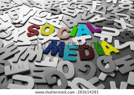 Color Social Media word in scattered black and white wood letters