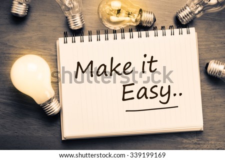 Make It Easy concept, handwriting on notebook with light bulbs Foto d'archivio © 