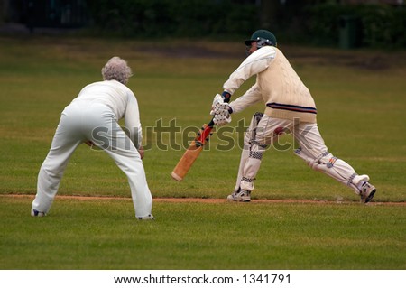 Action photo of people playing cricket