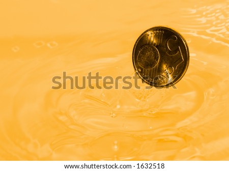 A euro coin drops into a gold liquid