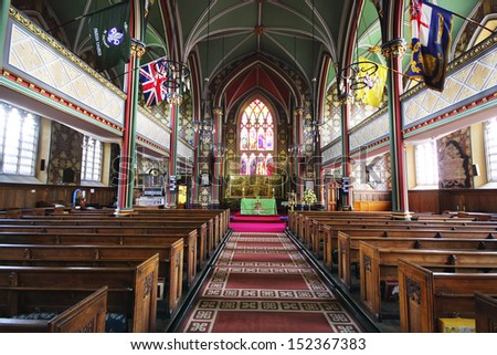 OLDHAM, UK - AUGUST 2013: Interior of Oldham Parish Church, Manchester, 31 August 2013. A Fun Day of inflatable bouncy castles and stalls selling cakes was held in the grounds of the Parish Church.