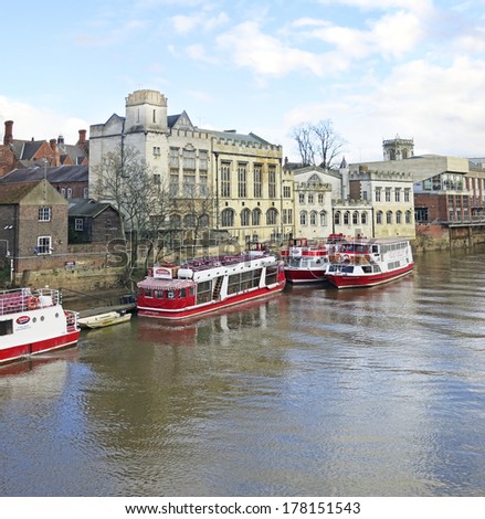 YORK,UK - FEBRUARY 2014: River boats in front the Guildhall, York, 20 February, 2014. York\'s 30th Jorvik festival explores the Viking world of myths and legends from the 15th February 2014