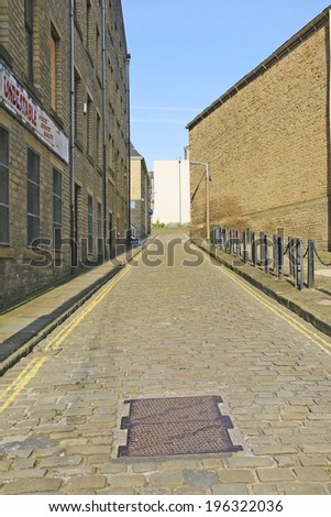 HALIFAX,UK - June 1, 2014: Cobbled back street, Halifax, West Yorkshire, England, UK, 1 June 2014. Halifax is a Minster town and well known for the manufacture of wool from the 15th century