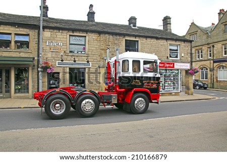 HEBDEN BRIDGE, WEST YORKSHIRE - AUGUST 2, 2014: Vintage commercial vehicle driving through Hebden Bridge which is taking part in the 46th Transpennine Commercial run from Manchester to Harrogate