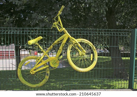 RIPPONDEN, WEST YORKSHIRE - AUGUST 11, 2014: Yellow Bike. Mementos of the Grand Depart (Tour de France 2014) still line the route through West Yorkshire