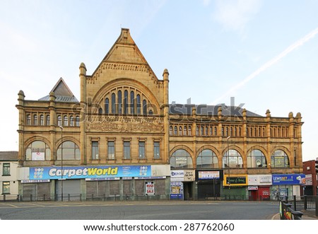 OLDHAM, UK - JUNE 15, 2015: Victorian commercial building, Oldham. Oldham Council is investing Â£400 million  in key regeneration projects including Metrolink