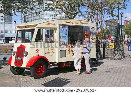 LIVERPOOL, UK - JUNE 30, 2015: Vintage ice cream van at Albert Dock. The Albert Dock is a major tourist attraction in the city and the most visited multi-use attraction in the UK, outside of London.