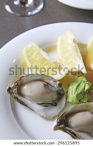 Oysters with lemon, pickled ginger and wasabi paste