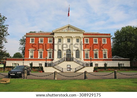 WARRINGTON, UK - AUGUST 23, 2015: Warrington Town Hall, Cheshire, England. The Town Hall, flanked by two detached service wings at right angles to the house, is a Grade I listed building