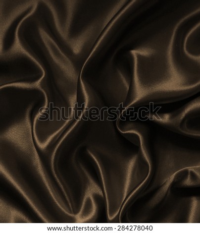 Smooth elegant golden silk or satin texture as wedding background. In Sepia toned. Retro style