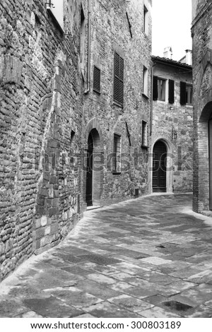 Italy. Tuscany region. Montepulciano town. Medieval street. In black and white toned. Retro style