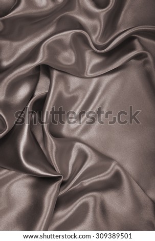 Smooth elegant brown silk or satin can use as wedding background. In Sepia toned. Retro style
