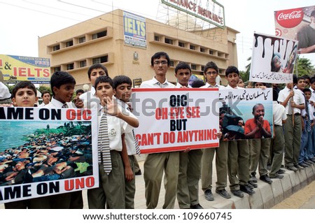 KARACHI, PAKISTAN - AUG 08: Students are protesting against killing of Muslims Peoples in Barma during a protest demonstration at Shahra e Faisal on August 08, 2012 in Karachi.