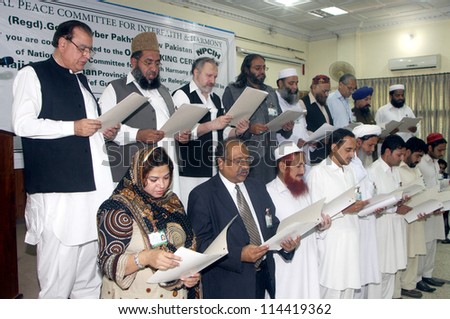 PESHWAR, PAKISTAN - OCT 02:  Religious Affairs Minister, Nimroz Khan administers oath to Members of National Peace Committee for Interfaith and Harmony on October 02, 2012 In Peshawar.