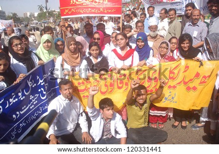 KARACHI, PAKISTAN - NOV 29: Students of SMC are protesting and demanding Sindh Medical University Bill to be passed immediately during a demonstration on November 29, 2012 in Karachi.
