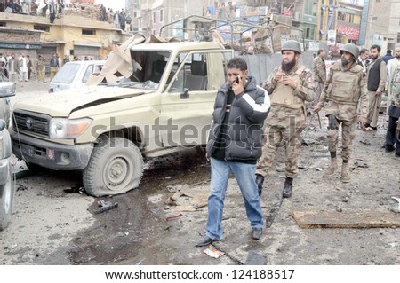 QUETTA, PAKISTANv - JAN 10: Security officials inspecting at site after bomb blast at Bacha Khan Chowk on January 10, 2013 in Quetta. At least eleven people were killed.