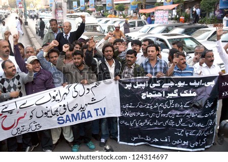 KARACHI, PAKISTAN - JAN 11: Karachi Union of Journalist chant slogans  against bomb blast at Qandhari Imambargah Alamdar Road and killing of several journalists in blast, on January 11, 2013.
