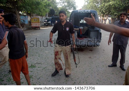 KARACHI, PAKISTAN - JUN 26: Injured victim of a bomb blast targeting the convoy of Sindh High Court Justice Baqar Maqbool, at Burns Road on June 26, 2013 in Karachi. At least seven people killed