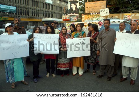 KARACHI, PAKISTAN - NOV 11: Civil Society are protesting against Jamat-e-Islami (JI) and demanding to ban JI because of its extremist and conservative behavior, on November 11, 2013 in Karach.