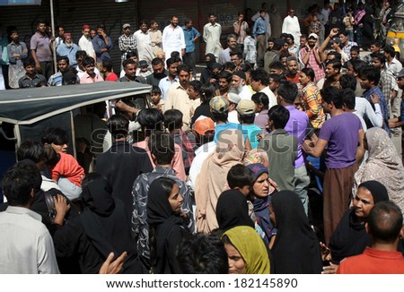 KARACHI, PAKISTAN - MAR 17: People are protesting against court order to vacant  government property which grabbed by mafias and settled into colonies, near Liaquatabad area on March 17, 2014 Karachi.