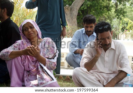 KARACHI, PAKISTAN - JUN 09: Relatives of missing Airport Security Force personnel wait for the updates after suspected militants attacked the Karachi Airport on June 09, 2014  in Karachi.