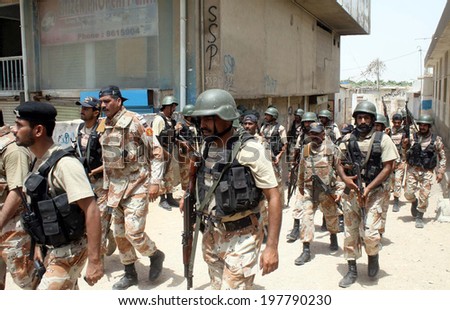 KARACHI, PAKISTAN - JUN10: Security forces are busy in search operation as they seal the whole area of Pehlwan Goth after an attack by unidentified persons on ASF camp 2, on June 10, 2014 in Karachi.