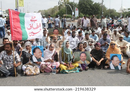 KARACHI, PAKISTAN - SEP 25: Activists and supporters of MQM are protesting against  detention of their fellow workers who arrested by Sindh Rangers during a raid on September 25, 2014 in Karachi.