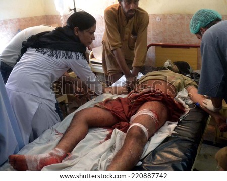 QUETTA, PAKISTAN - OCT 01: Injured of dual hand crackers attacks on male hair dressing salons and massage centers at Double Road are being treating at Civil Hospital  on October 01, 2014 in Quetta.