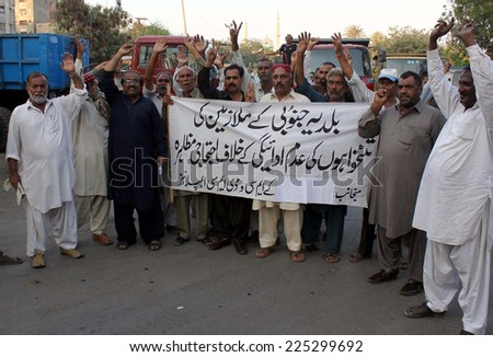 KARACHI, PAKISTAN - OCT 22: Karachi Metropolitan Corporation (KMC-South District)  employees are protesting against nonpayment of their salaries during a protest on October 22, 2014 in Karachi.