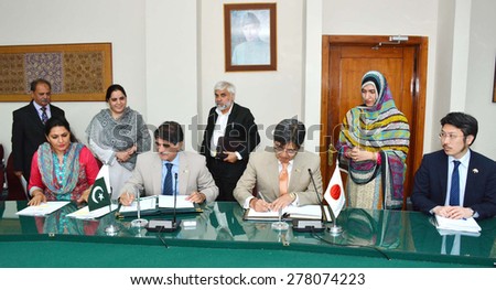 ISLAMABAD, PAKISTAN - MAY 14: Mr. Ambassador of Japan to Pakistan and Secretary Economic Affairs Division, signing agreement between Govt of Pakistan and Japan on May 14, 2015  in Islamabad .
