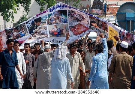 PESHAWAR, PAKISTAN - JUN 05: Residents of Peshawar are protesting against massacre of Rohangya Muslims in Burma, during a demonstration outside press club on June 05, 2015 in Peshawar.