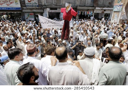 PESHAWAR, PAKISTAN - JUN 08: Members of Traders Community are protesting against \
massacre of Rohangya Muslims in Burma during demonstration in Peshawar on Monday, June 08, 2015.