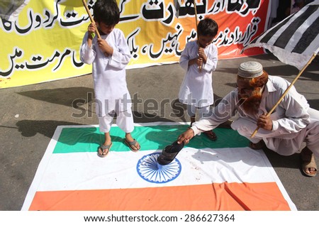 KARACHI, PAKISTAN, JUN 12: Activists of Jamat-ud-Dawah are protesting against India and massacre of Muslims by Buddhist in Burma during a rally on June 12, 2015 in Karachi.