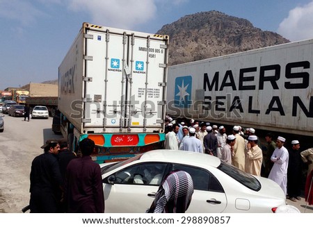 LANDIKOTAL, PAKISTAN - JUL 22: Transporters block Afghan Torkham border route as they are protesting against high handedness of Khyber Khasadar Force officials on July 22, 2015 in  Landikotal.