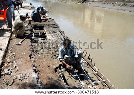 PESHAWAR, PAKISTAN - JUL 27: View of destruction at flood affected area while heavy flood water flowing area after heavy downpour of monsoon season, on July 27, 2015  in Peshawar.