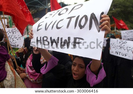 KARACHI, PAKISTAN - AUG 04: National Trade Union Federation Pakistan members are  protesting against encroachment operation held at Afghan slum in Islamabad, on August 04, 2015 in Karachi.