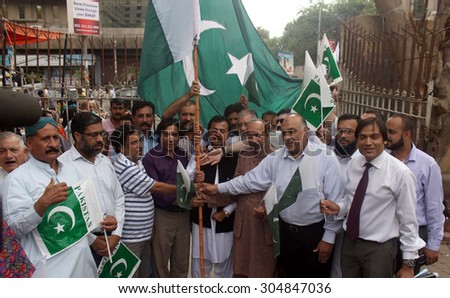 KARACHI, PAKISTAN - AUG 10: Activists of Muslim League-Q are chanting slogans for \
Pakistan to show their patriotism during a demonstration held on August 10, 2015 in Karachi.