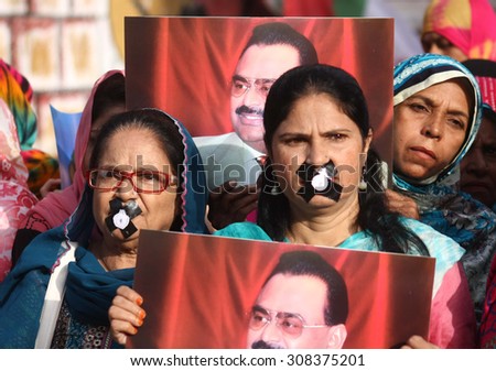 KARACHI, PAKISTAN - AUG 21: MQM activists gathered at press club to protest against attack on Rasheed Godil, ban on Altaf Hussain speech on August 21, 2015 in Karachi.